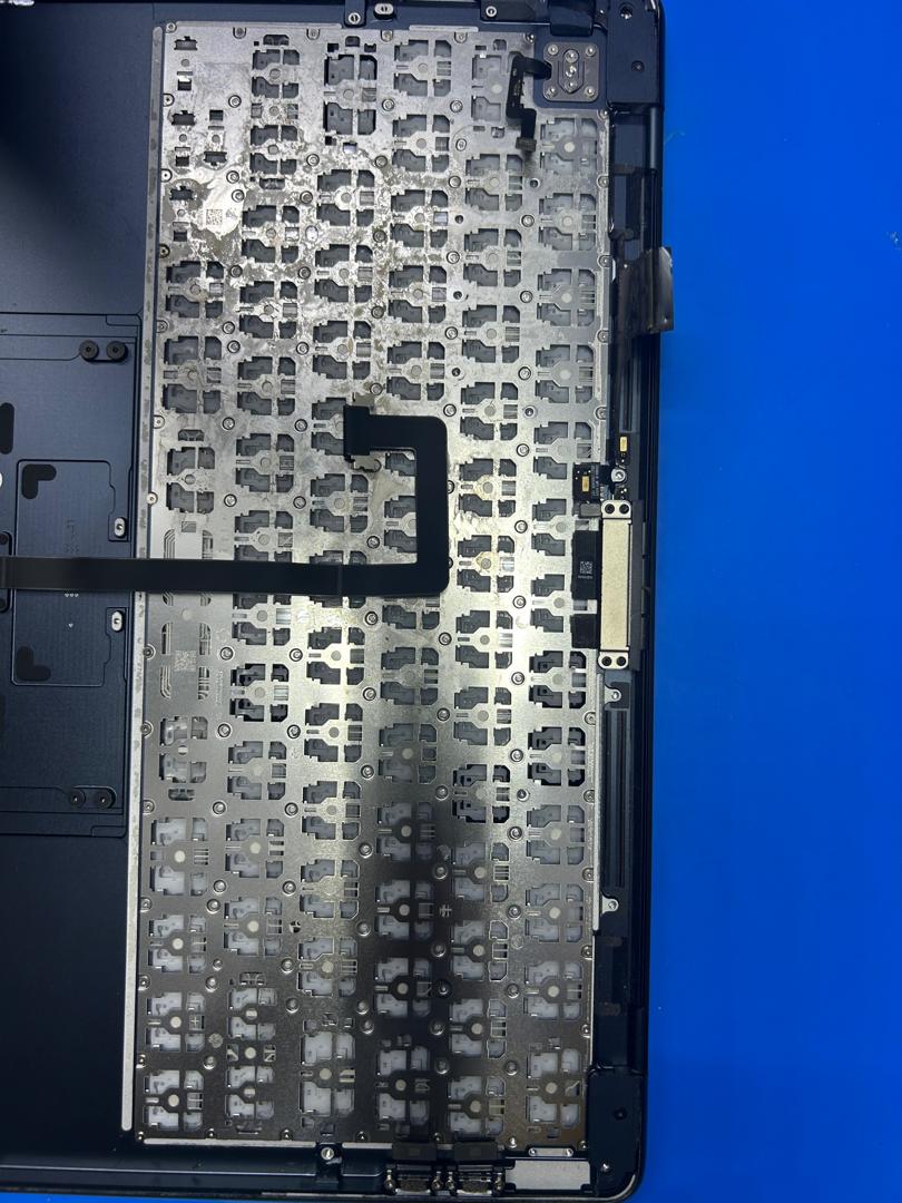 MacBook keyboard plate exposed during replacement